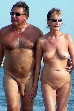 Mature couples posing with no any clothes outdoors